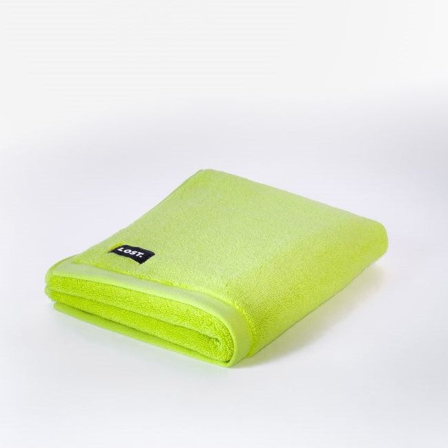 folded chartreuse bath mat