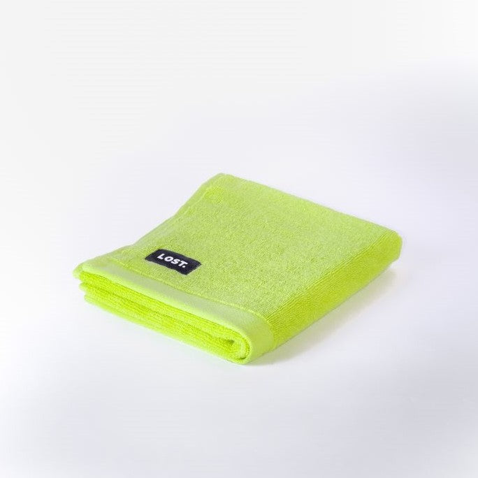 folded chartreuse hand towel