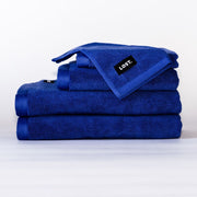 stack of electric blue bath towels