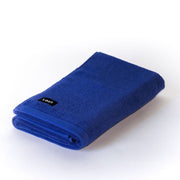 folded electric blue bath towel