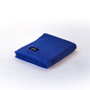 folded electric blue hand towel