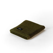 folded khaki hand towel