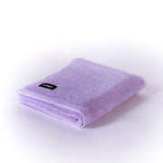 folded lilac bath mat