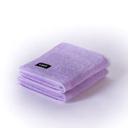 two folded lilac hand towels